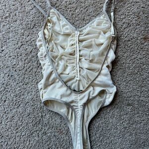 Ruched golden color body suit, with the cutest sparkle details!